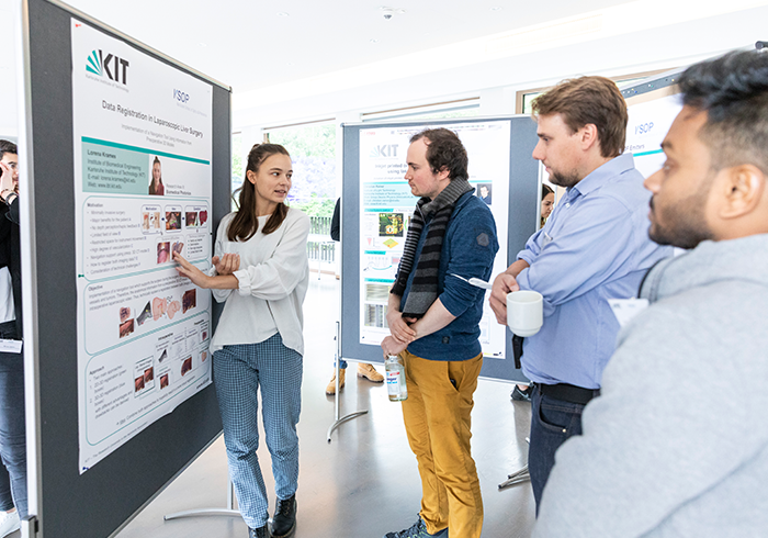 KSOP doctoral researchers talking to each other at the KSOP Summer School during the poster session