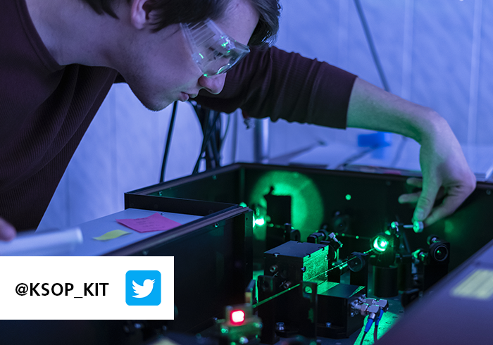 A student working with a laser in a lab